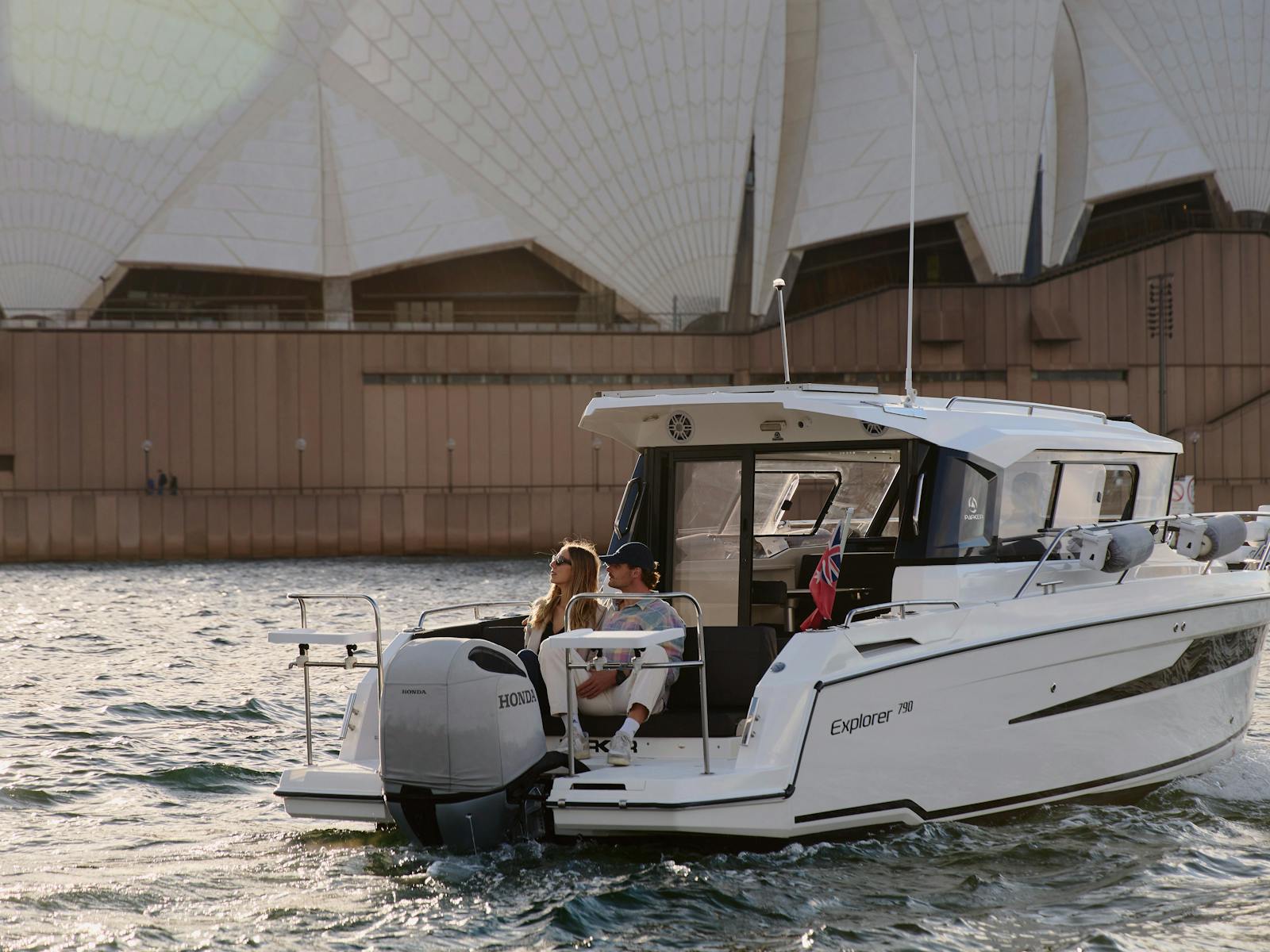 MV Explorer luxury cruise boat on Sydney Harbour with Harbour Bridge in the background.
