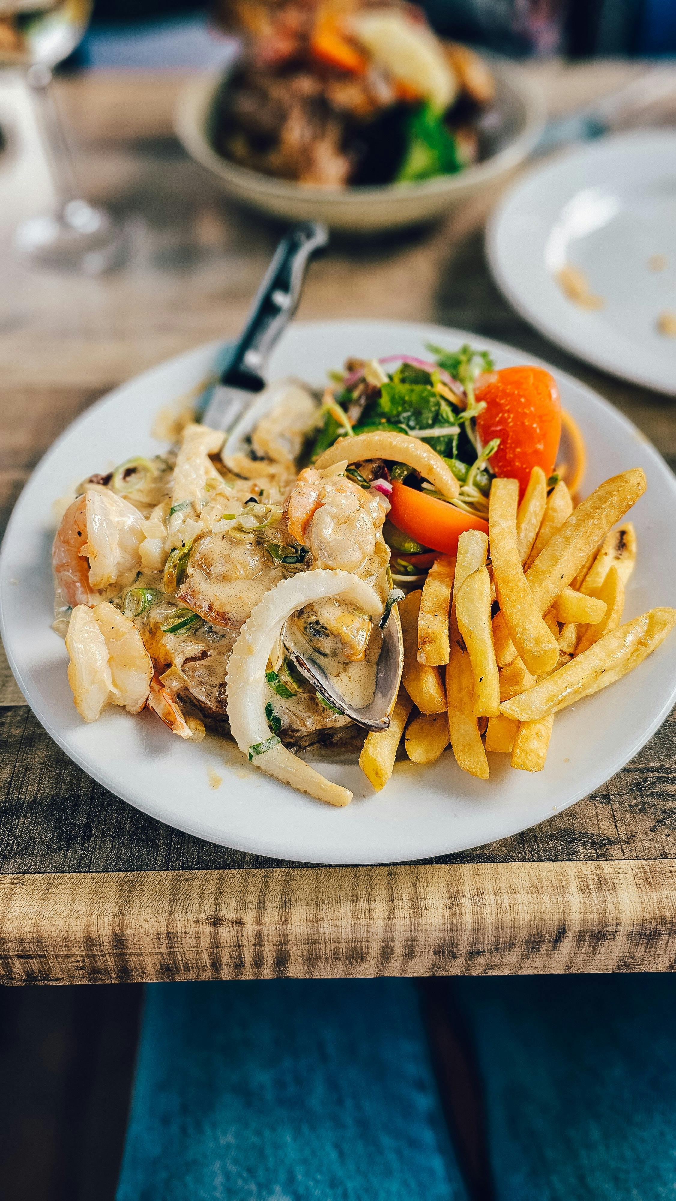 Seafood and chips served on a plate