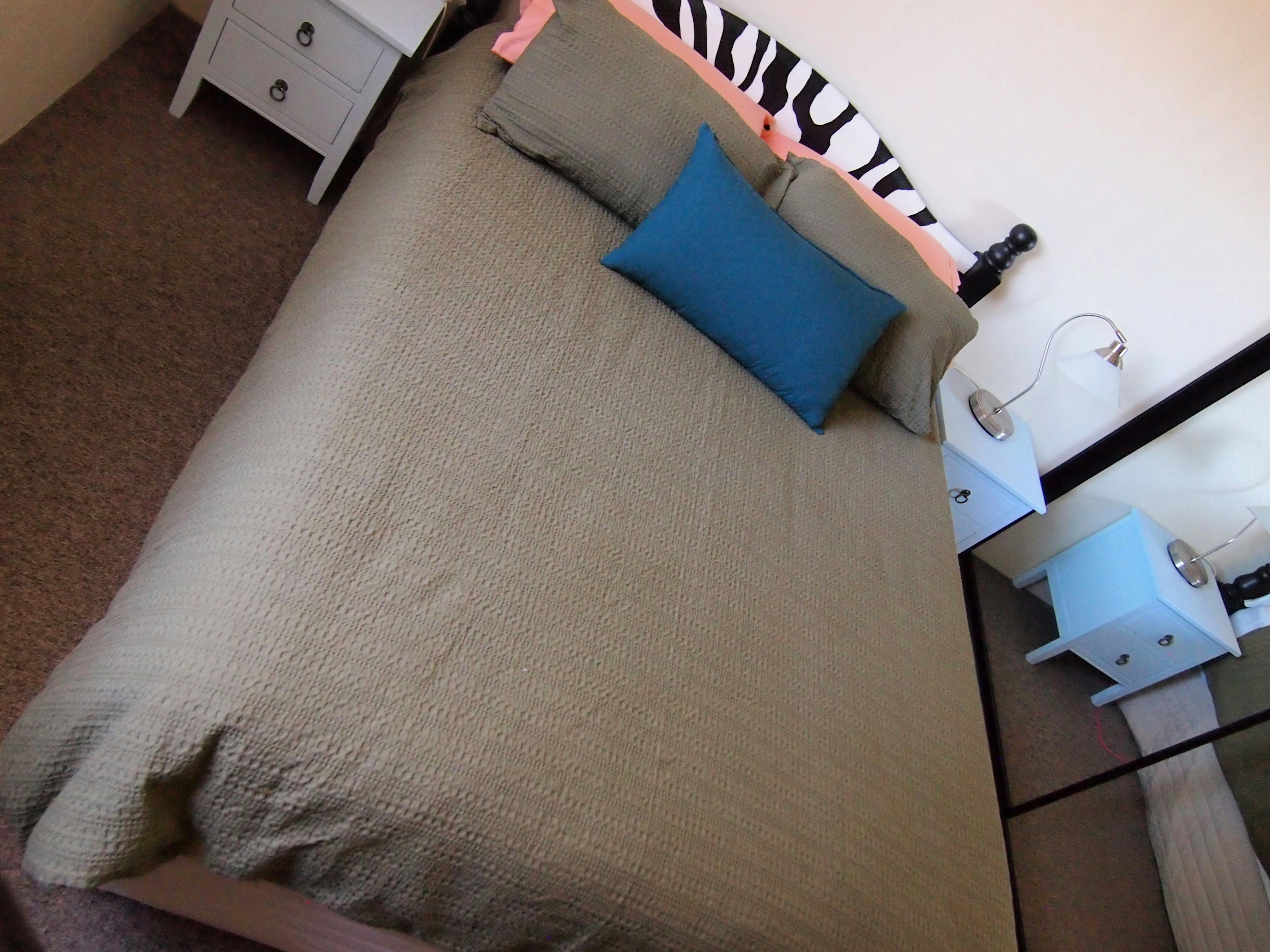 Olive bedspread and Duck egg bedside tables