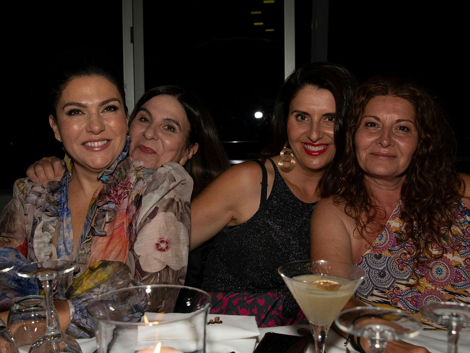 Guests enjoying dinner and drinks on the Clearview glass boat on Sydney Harbour