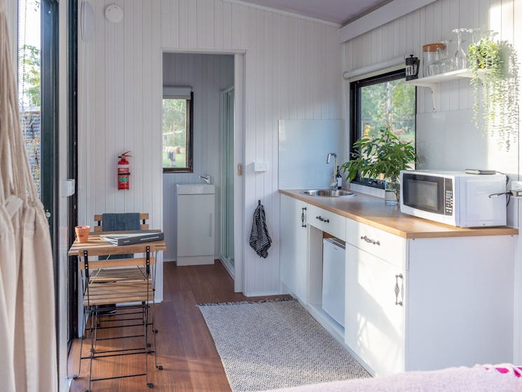 Our tiny house comes with a fully equipped kitchenette for you to display your cooking prowess