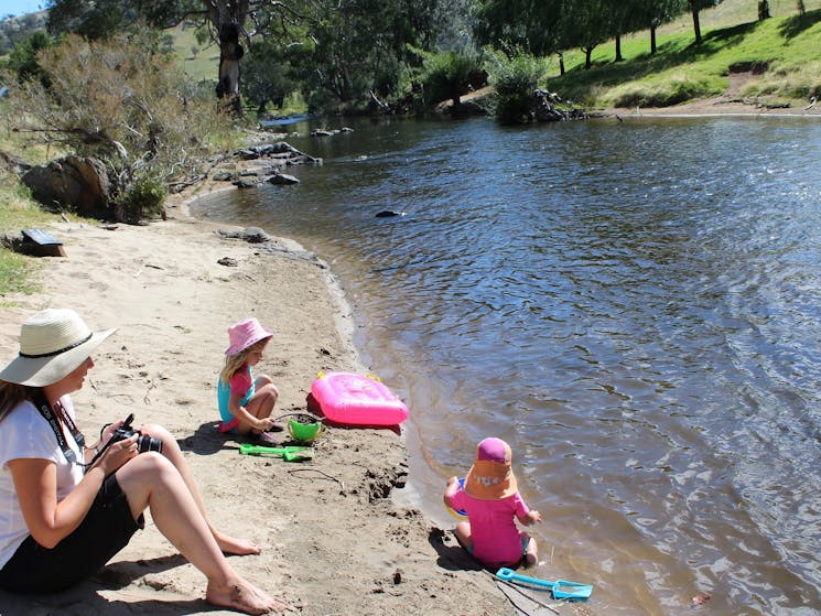 Children playing at one of the sandy river beaches at Elm Cottage