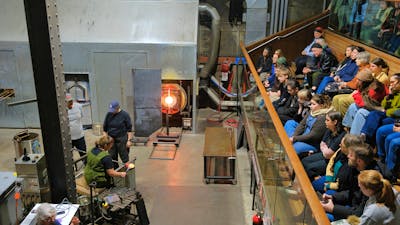 Crowds watching glassblowing