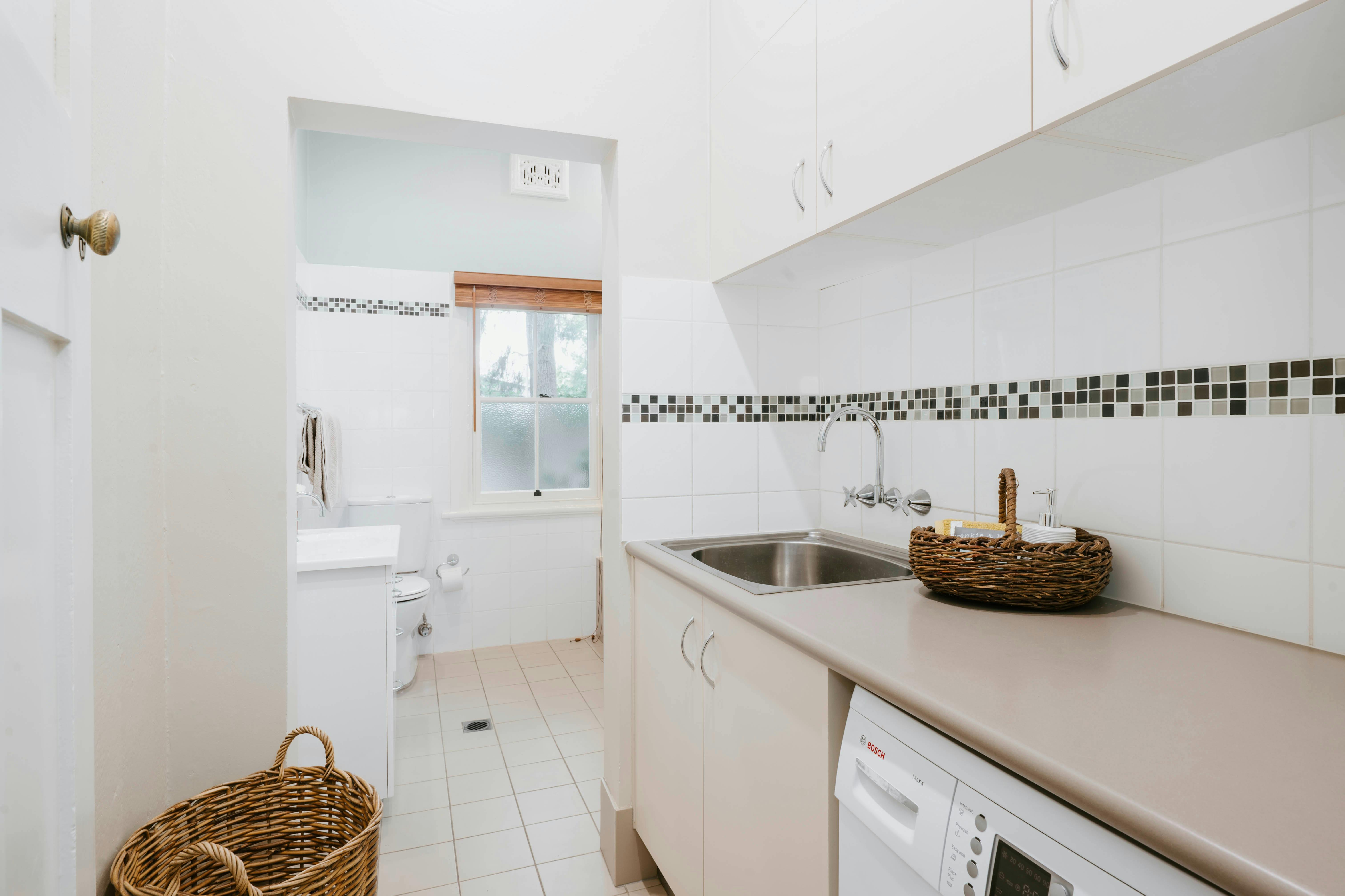 Laundry with deep sink, washing machine, iron & airer