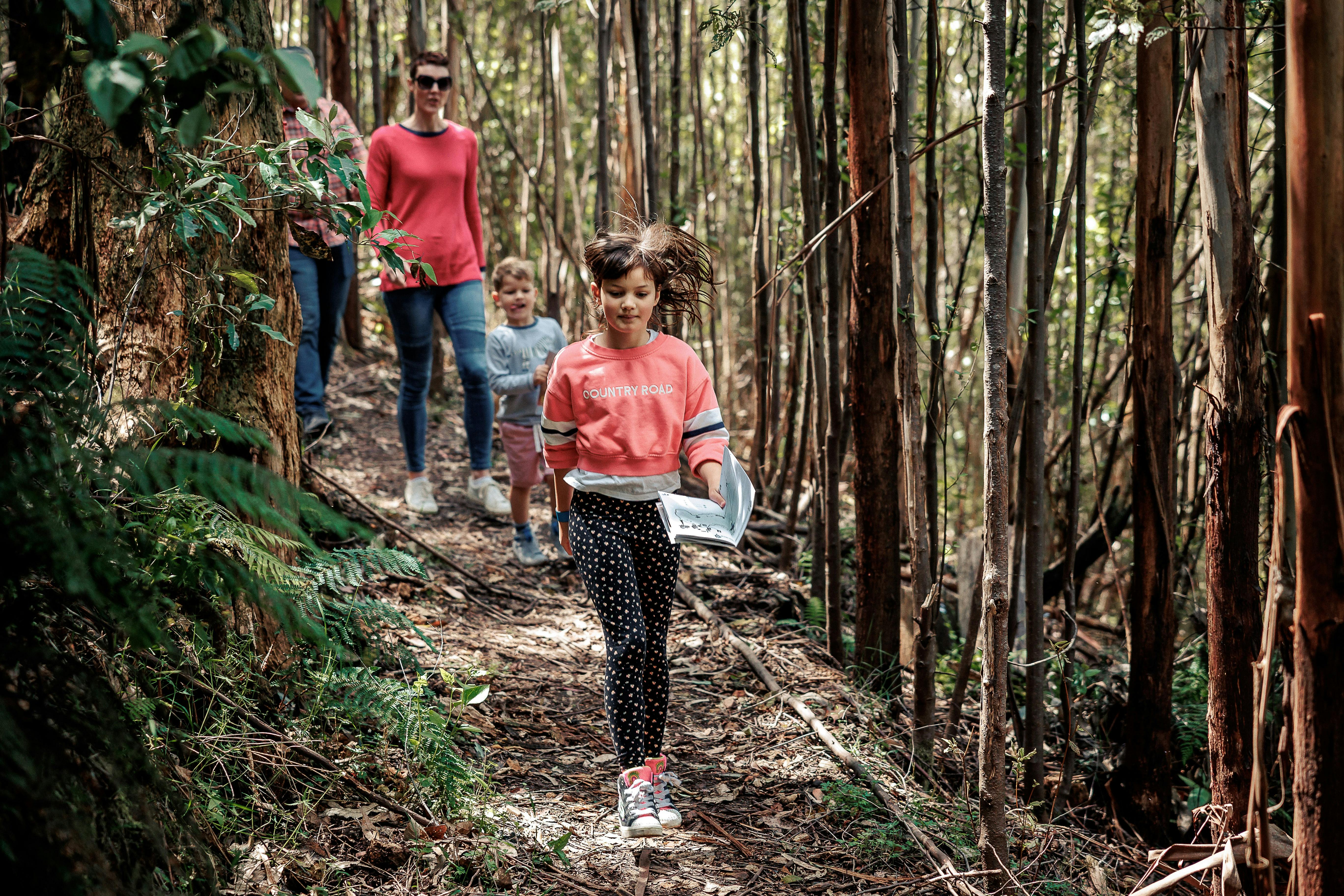 A family walking through the bush