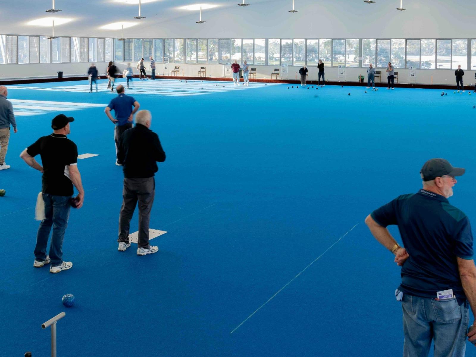 people playing Indoor Bowls