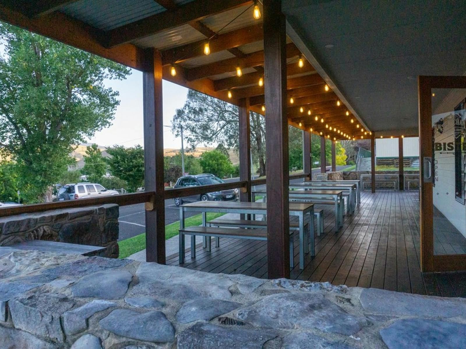 Tables and chairs on a verandah