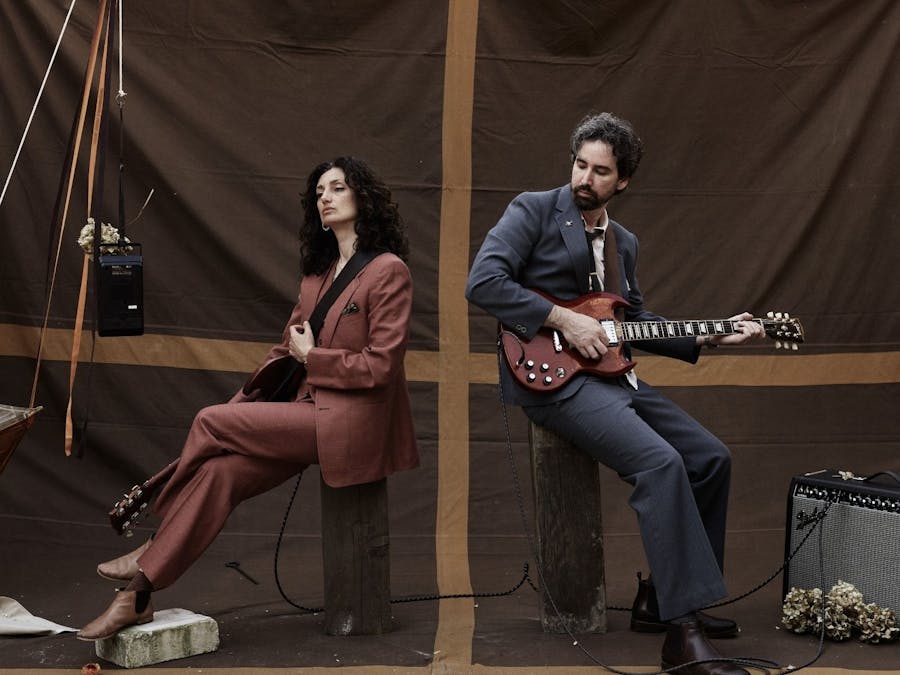 Joe Wilson & Chanelle Collier posing with their guitars