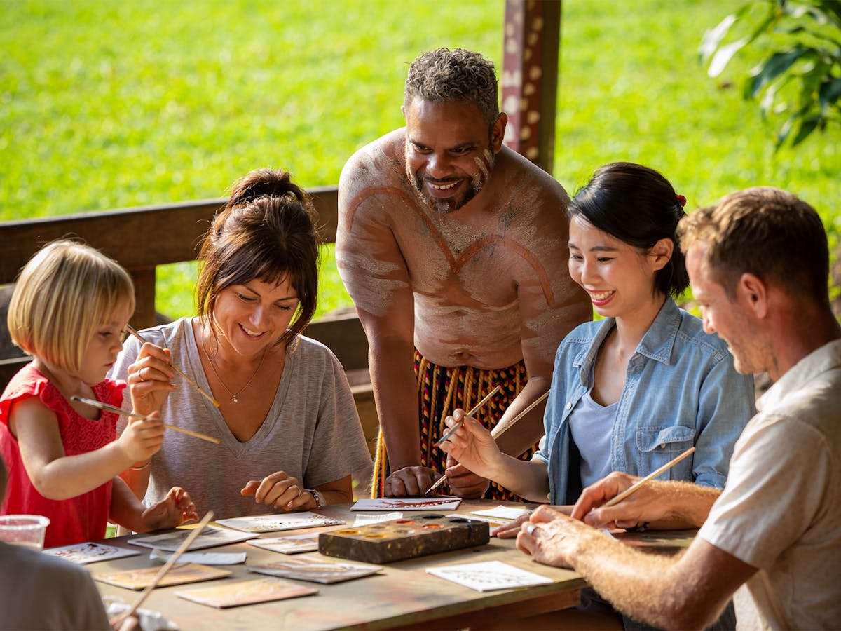 Group taking part in Aboriginal Art Boomerang Painting at Rainforestation