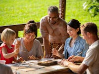 Group taking part in Aboriginal Art Boomerang Painting at Rainforestation