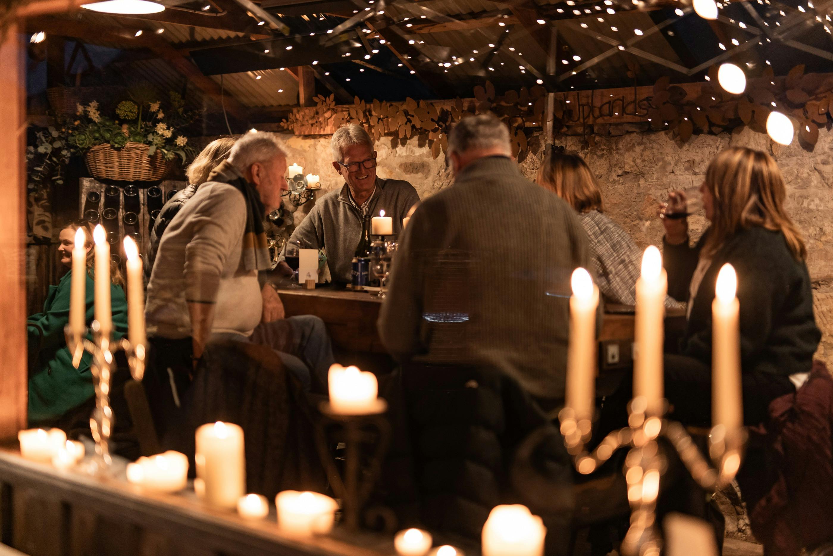 people in shed with lots of candles