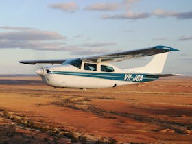 Wrightsair aircraft takes passengers for a scenic flight over spectacular Anna Creek Painted Hills