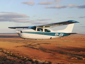 Wrightsair aircraft takes passengers for a scenic flight over spectacular Anna Creek Painted Hills