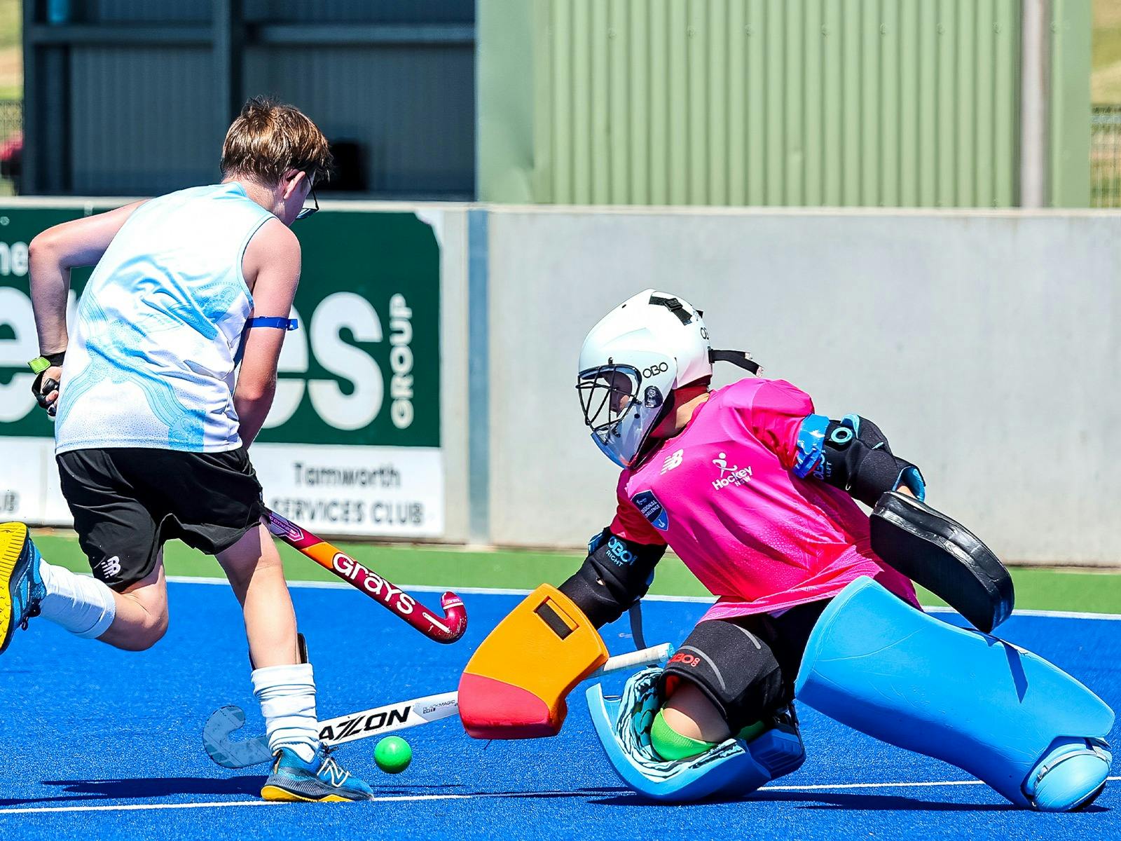 Goalkeeper Making a Stick Save in Hockey