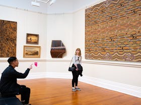 Young couple looking at an artwork