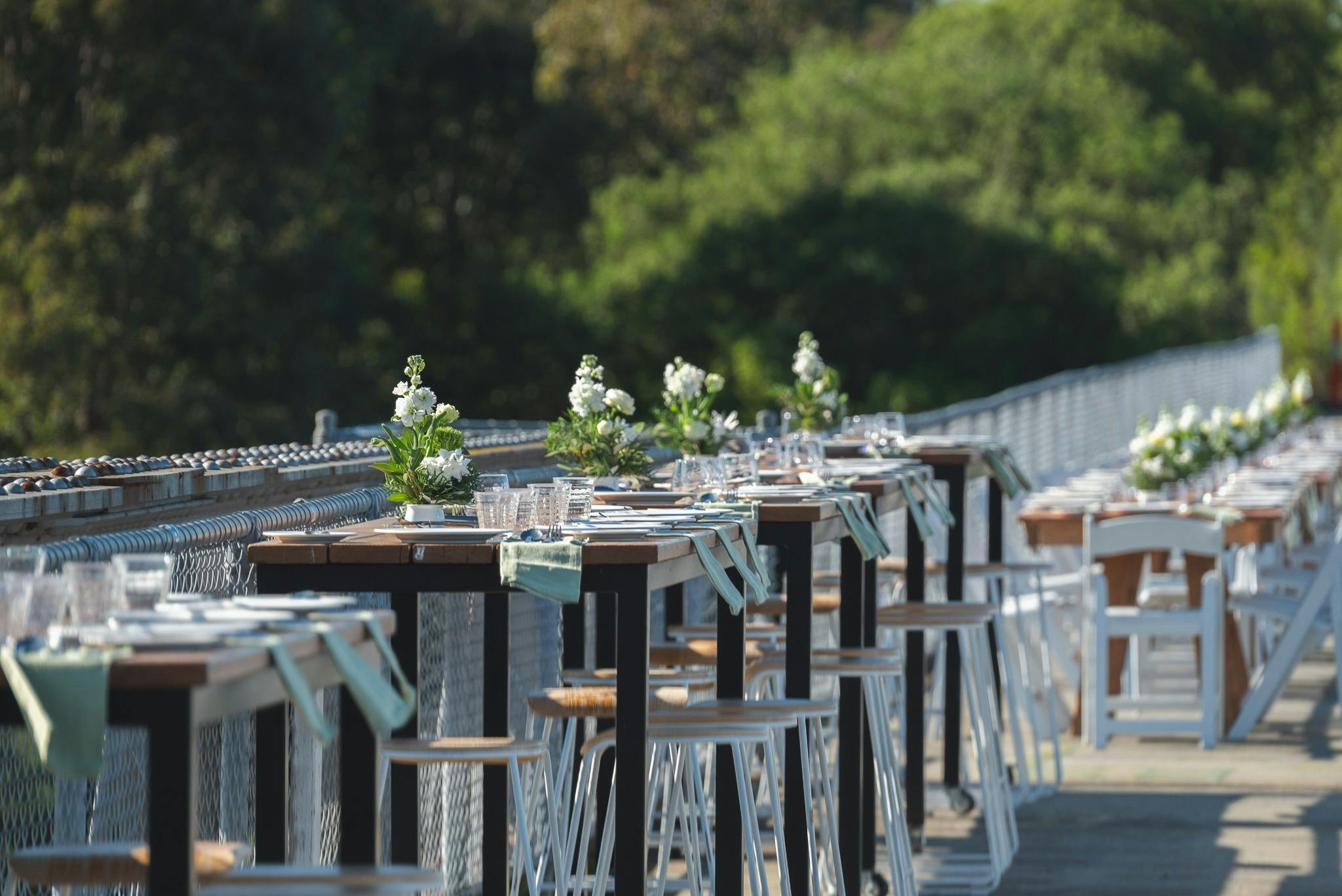 Tables are set for a long lunch on  the old Nicholson River Railway Bridge