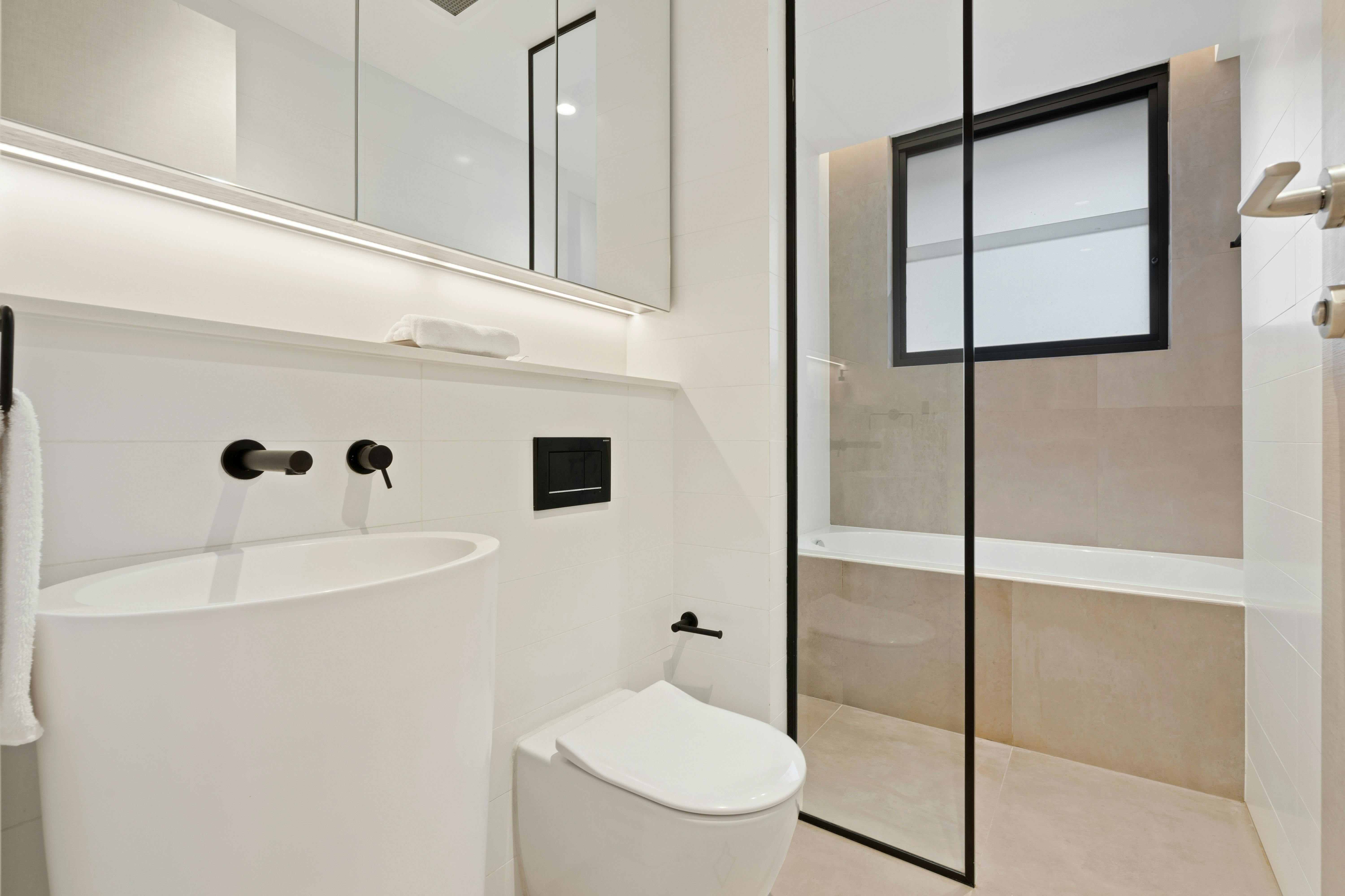 Contemporary bathroom with sleek shower and modern fixtures.
