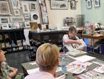 local artist demonstrating how to create an artist book