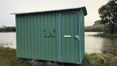 The bird hide overlooks a large dam that teems with water fowl