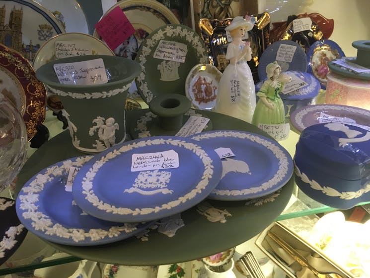 A display of Wedgwood, Limoges and royal souvenir ware