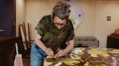 Inke Falkner using the technique of French straw marquetry on her artwork Round and Round