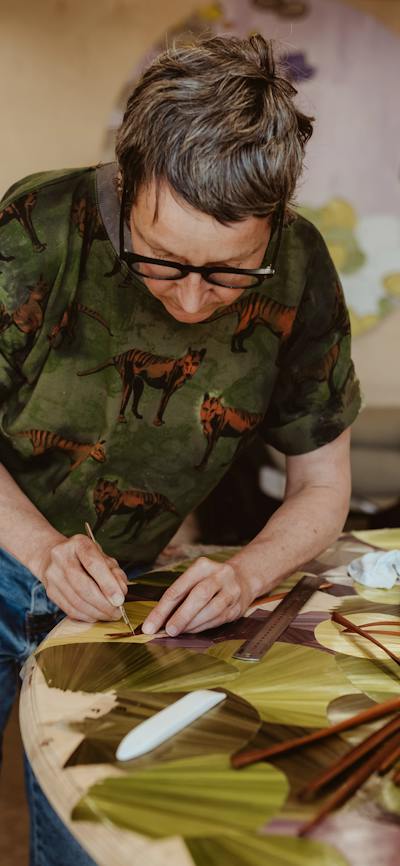 Inke Falkner using the technique of French straw marquetry on her artwork Round and Round