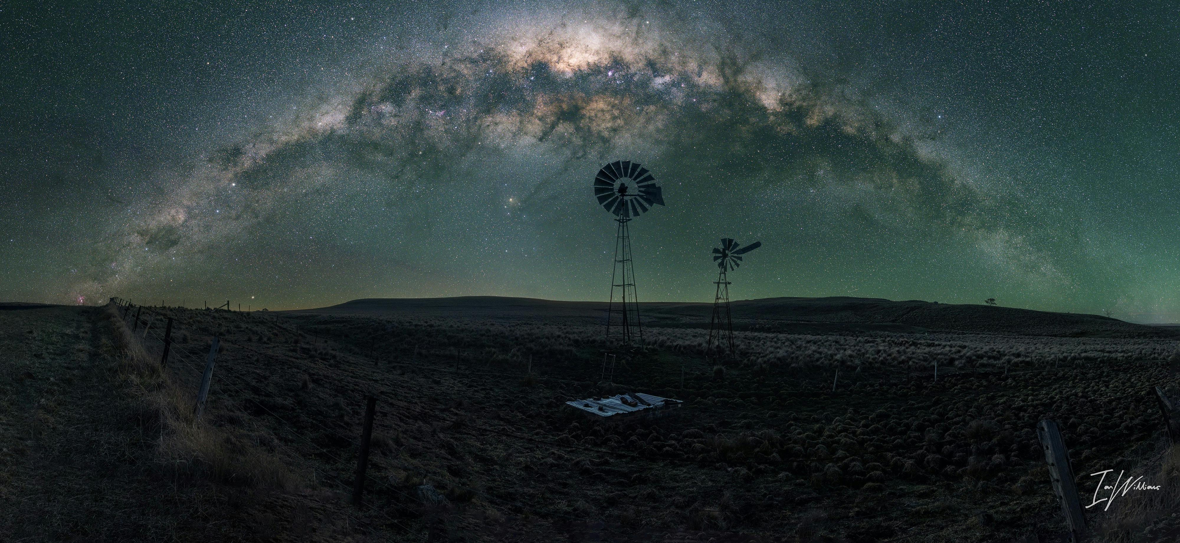 A typical rural scene in country near Canberra with setting arch of the Milky Way
