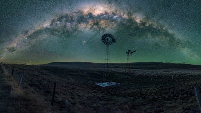 A typical rural scene in country near Canberra with setting arch of the Milky Way
