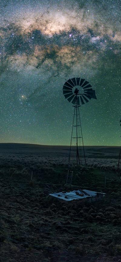 A typical rural scene in country near Canberra with setting arch of the Milky Way