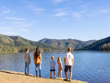 Family looking out at the dam