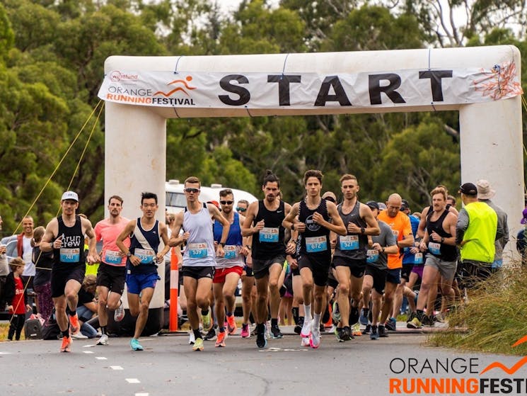 Start of the Orange Running Festival 5K with male runners starting fast