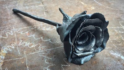 a steel rose made using decorative blacksmithing techniques