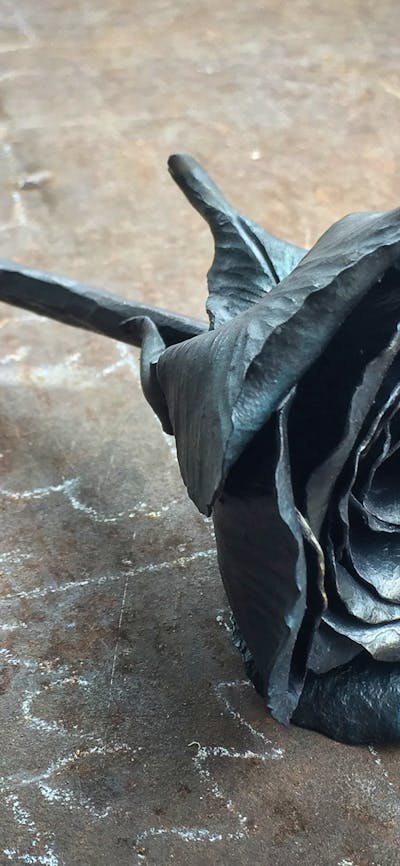 a steel rose made using decorative blacksmithing techniques