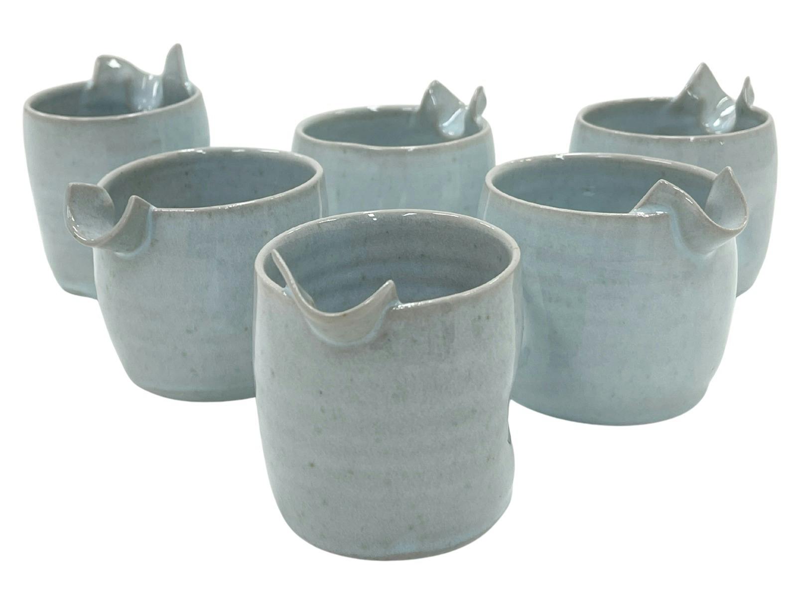 A set of 6 pourers by Rebecca Dowling