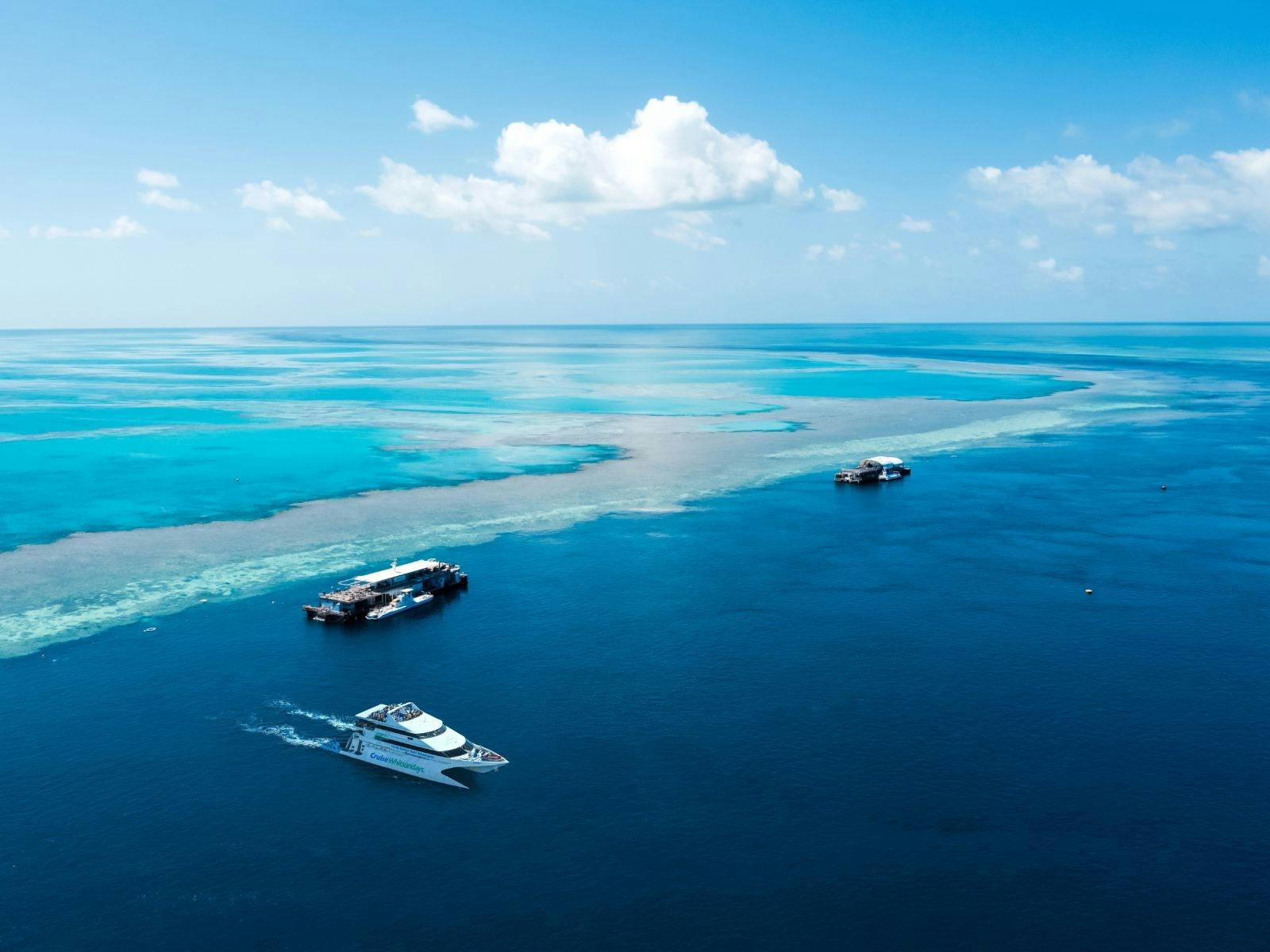 Aerial view of the Great Barrier Reef with a view of the Reefworld pontoon