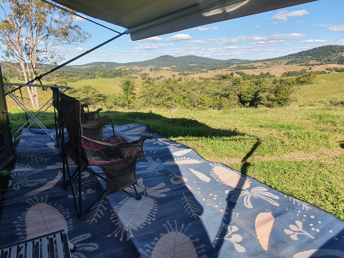 Honeyeater Haven at Crediton via Eungella Qld camp chairs under awning  and fire pit with a view