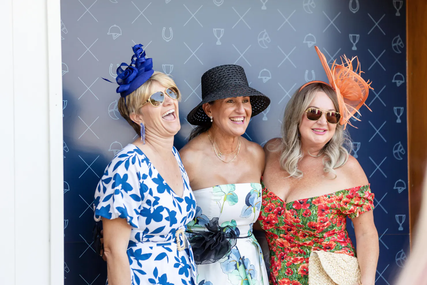 Group of three ladies laughing and having their photo taken