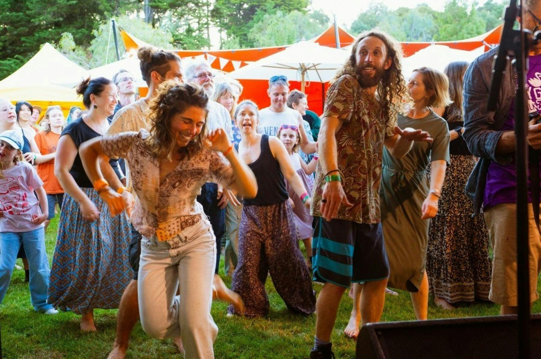 Couple dancing joyously at the festival