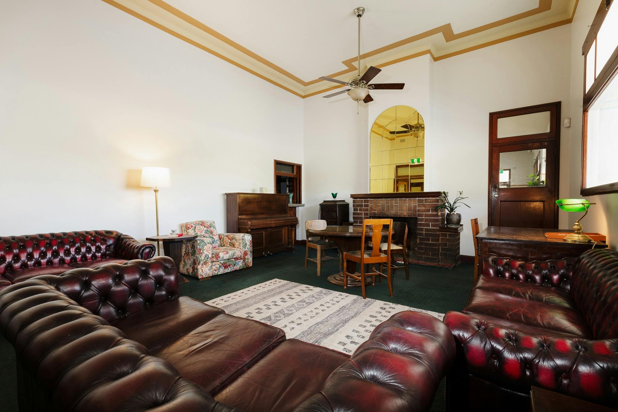 Large room high ceiling leather couches