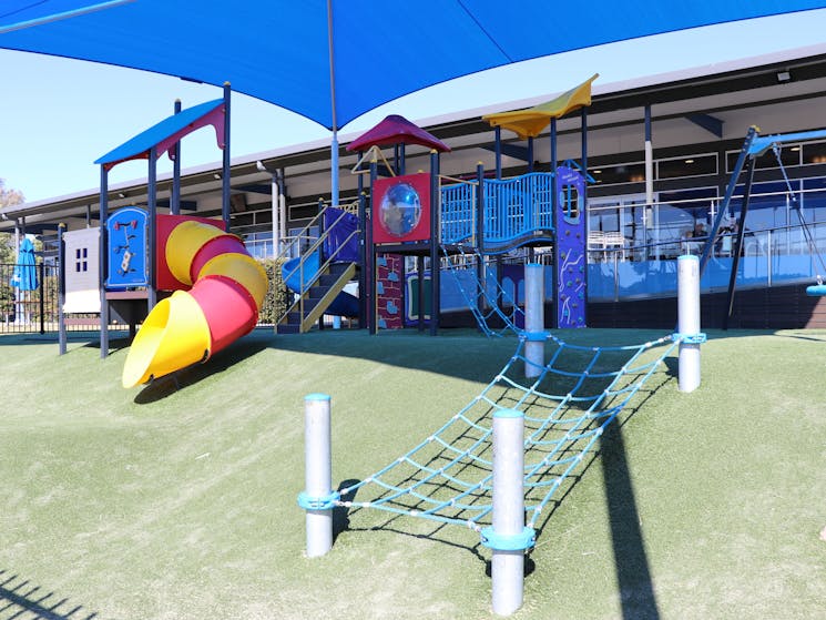 Shaded outdoor playground at Tradies Helensburgh