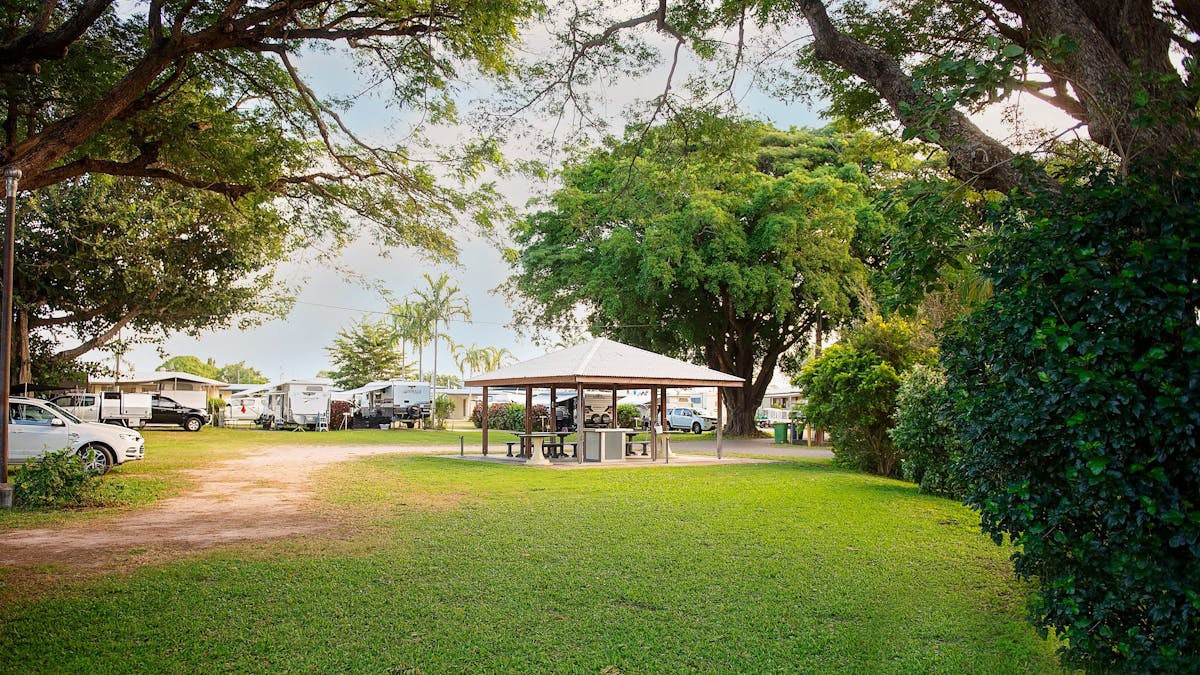 Tranquil and shady interior of Burdekin Cascades Caravan Park
