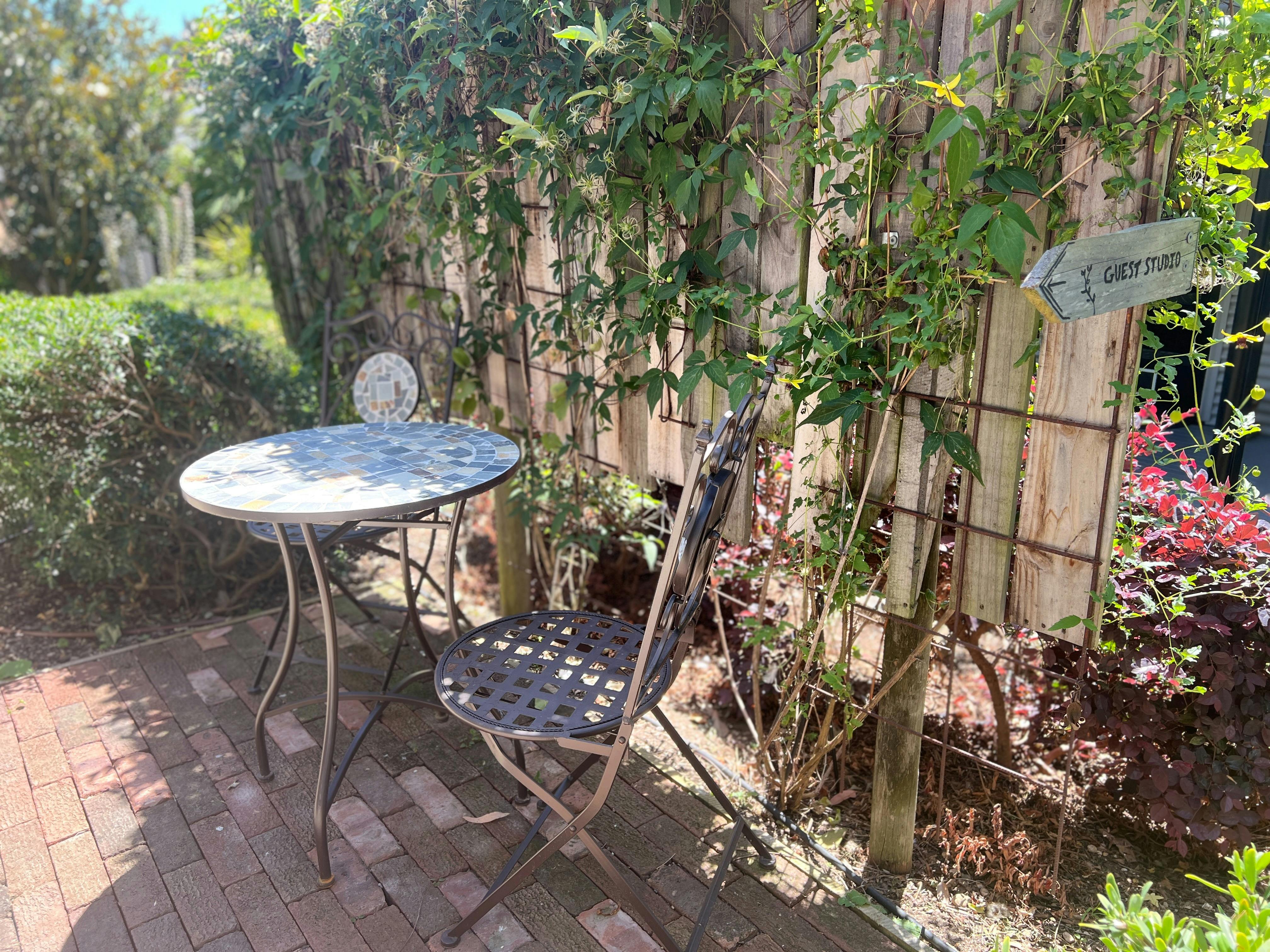 Outdoor table and chairs, garden surrounds