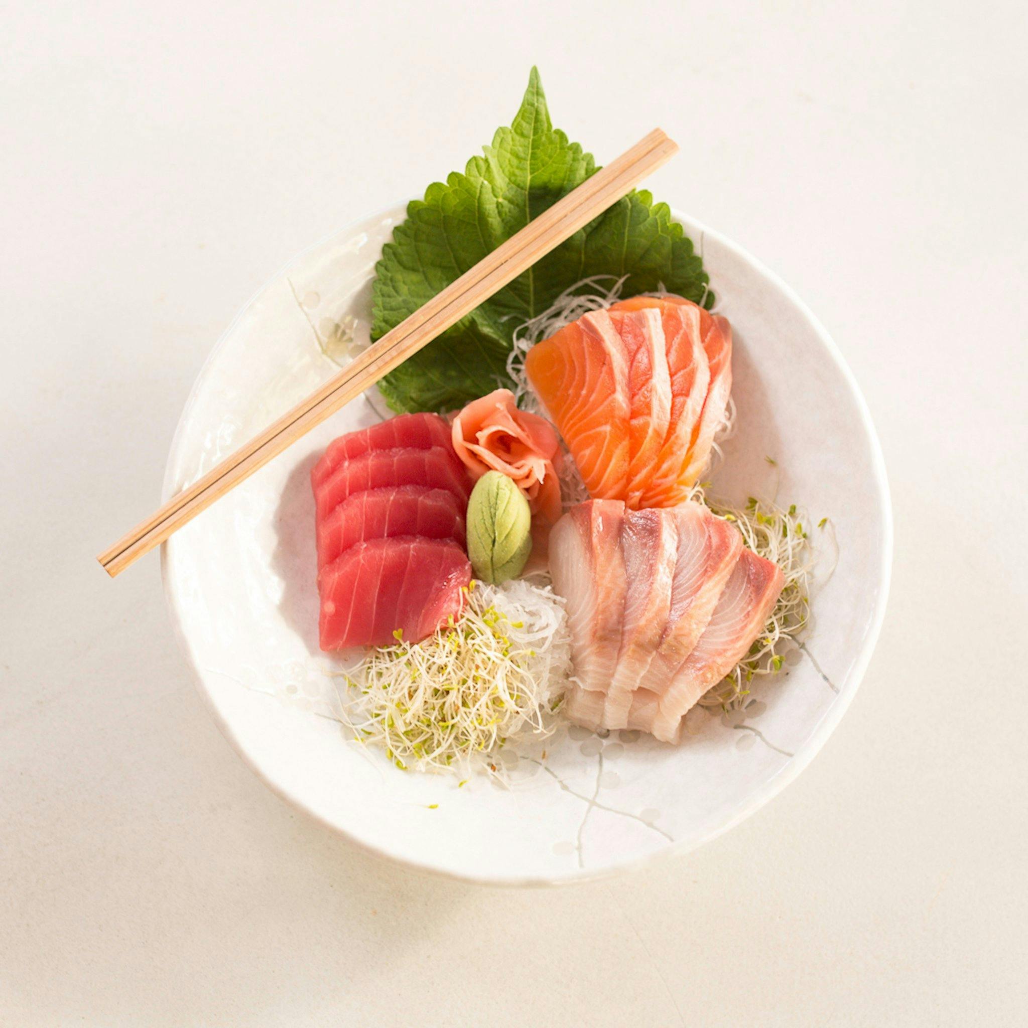 Plate of raw fish and bean sprouts