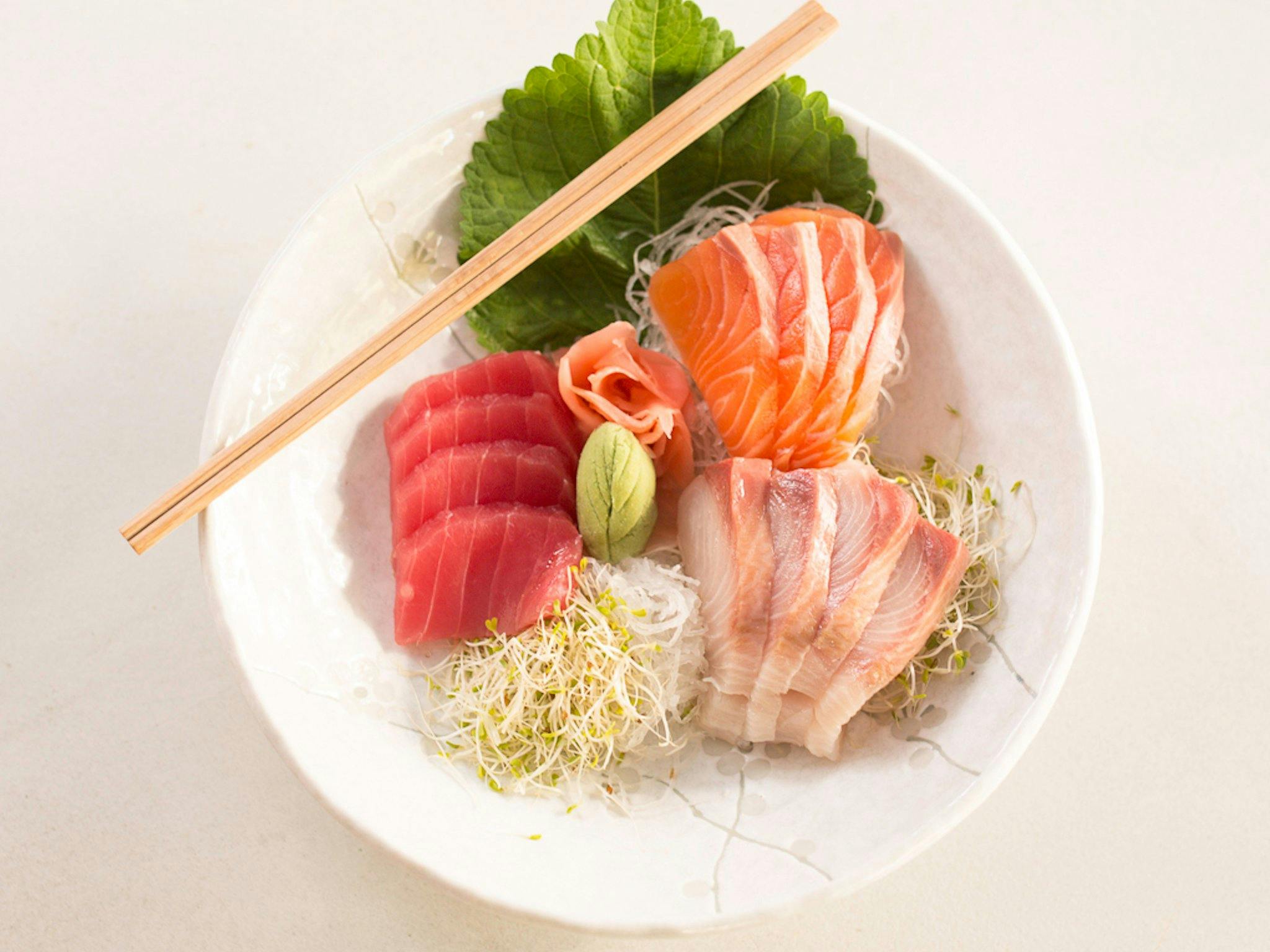 Plate of raw fish and bean sprouts