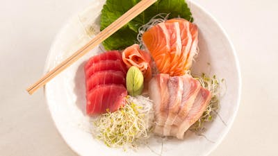 Plate of raw fish and bean sprouts