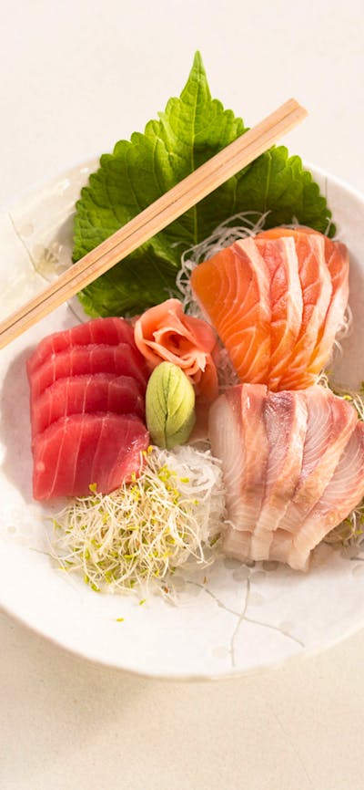 Plate of raw fish and bean sprouts