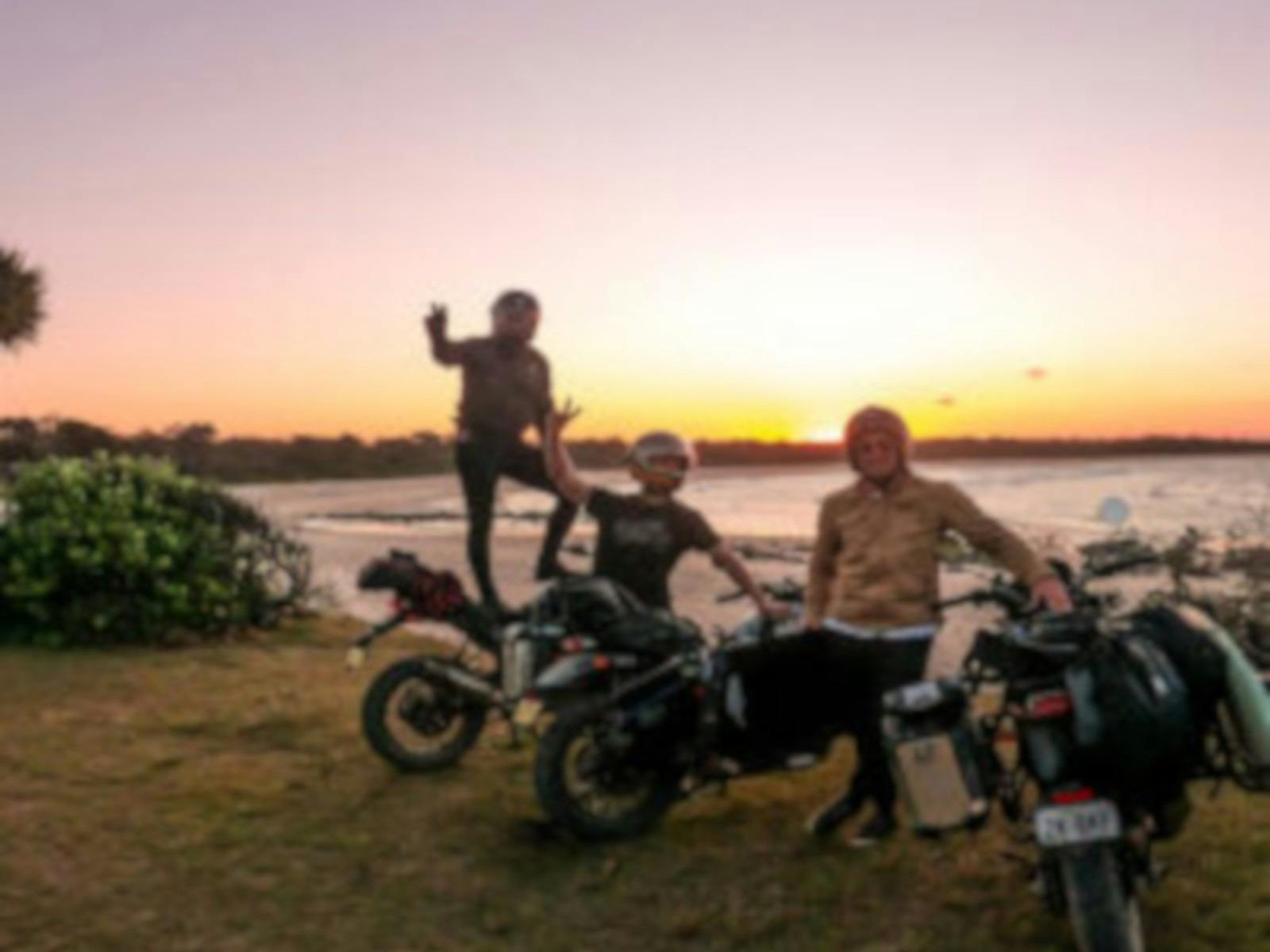 men on motorcycles parked near the beach