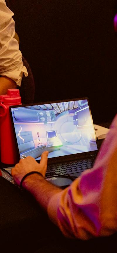 Man in front of a screen wearing headphones