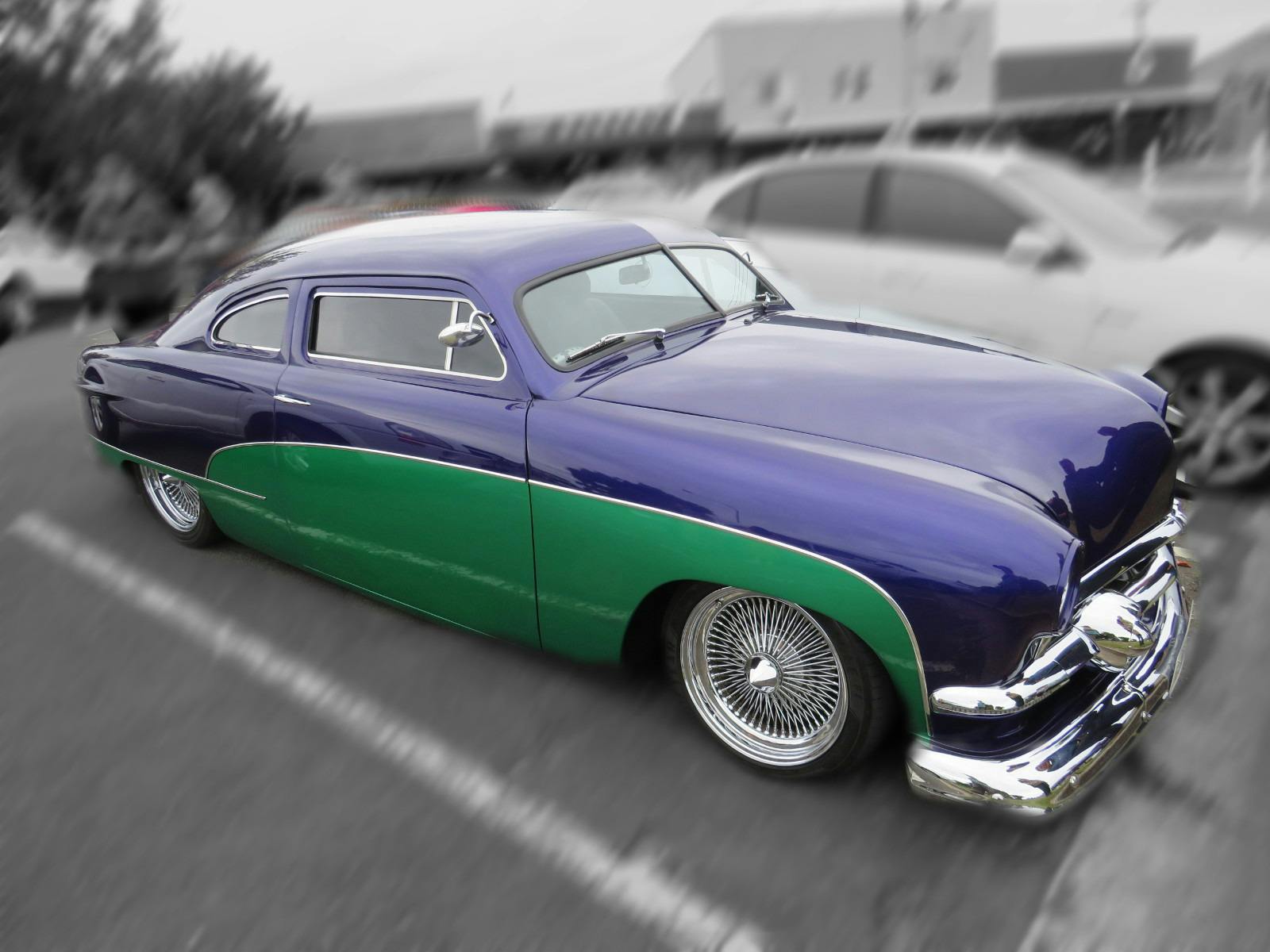 A streamline moderne limo, art deco on wheels in purple and green