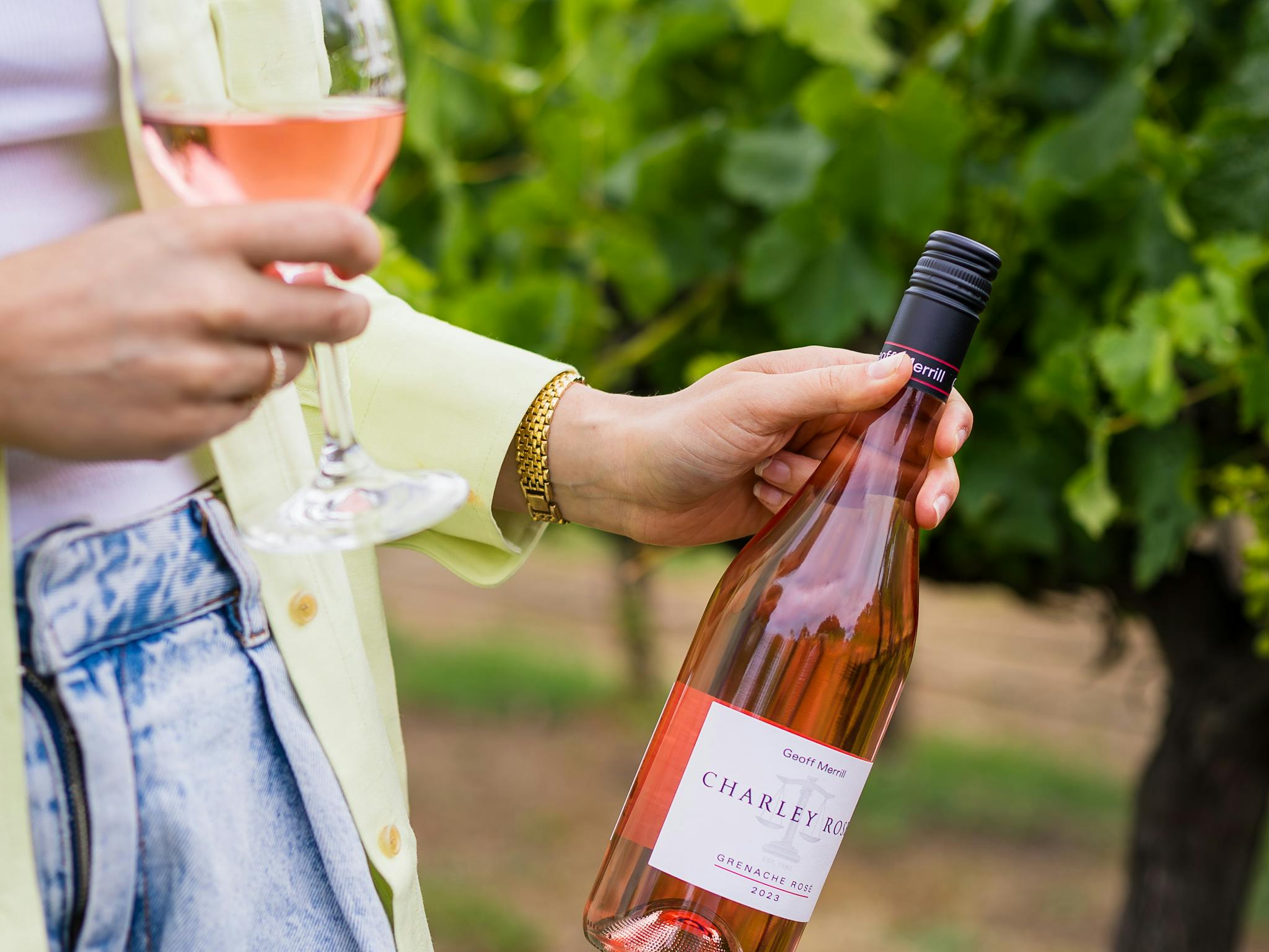 Rose glass of wine against the vineyards